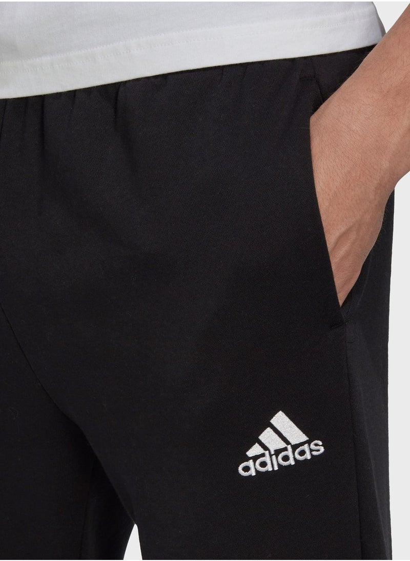 اديداس - Essentials Fleece Regular Tapered Pants - Image 1