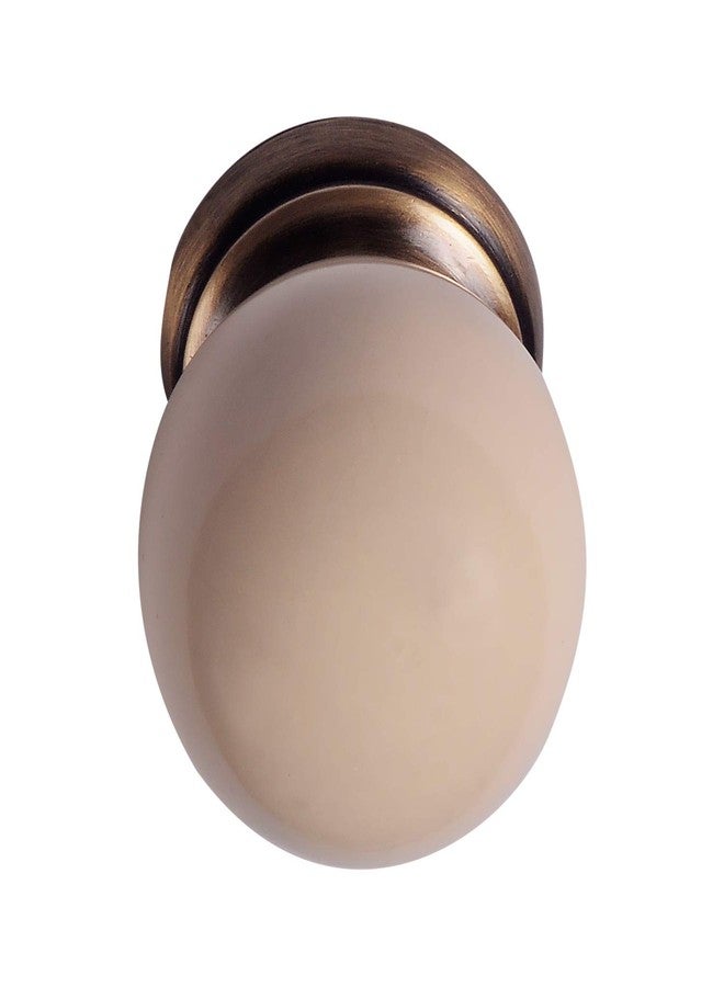 HOBKNOBS Single Ceramic Ball Antique Brass Knob (40 mm, Cream) - Image 1