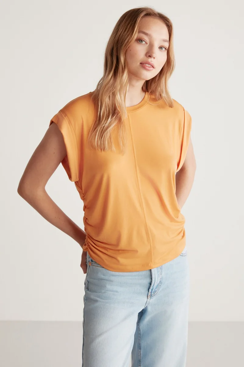 جريميلانج Roberta Women Sandy Flowy and Flexible Fabric Low Shoulder Sleeveless Oversize Orange Blouse