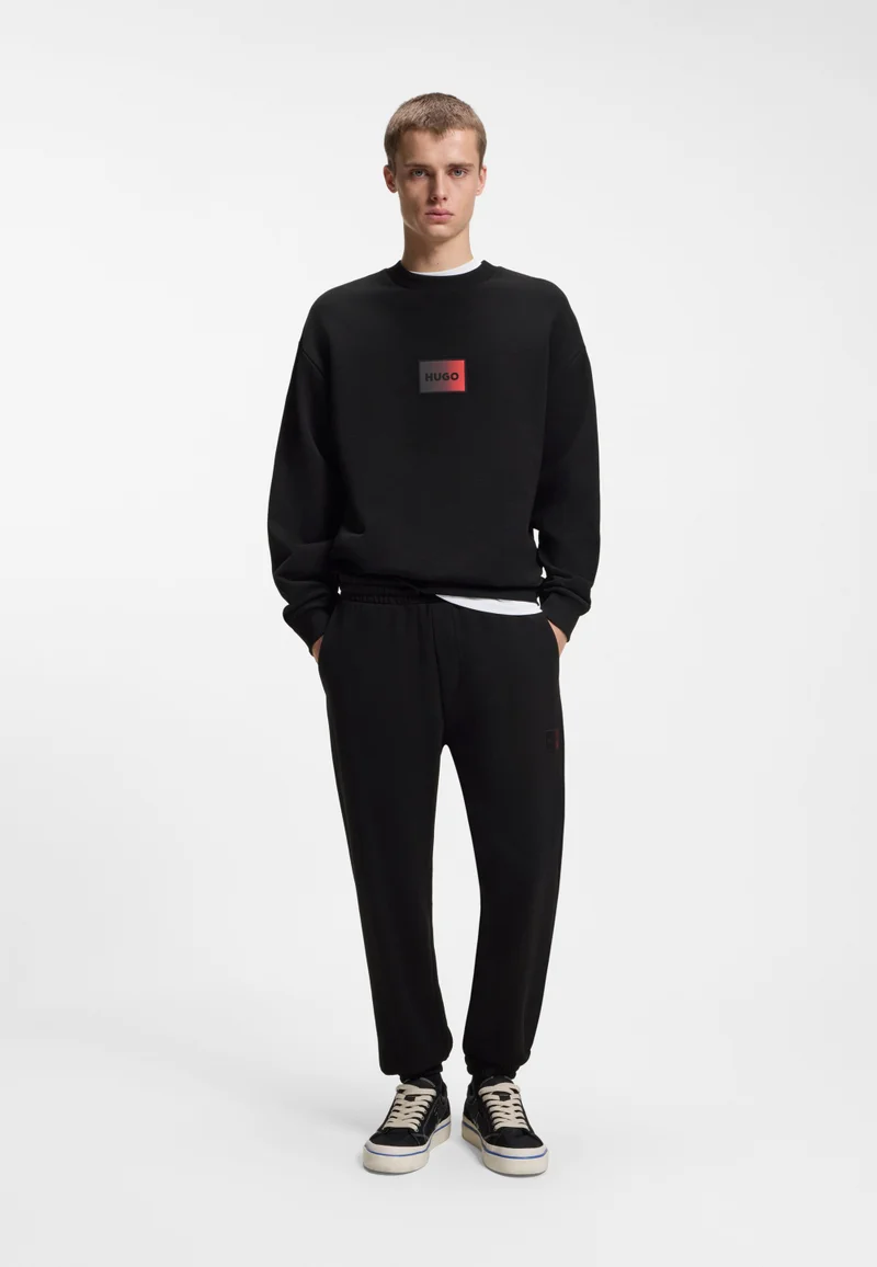 HUGO Black Cotton-terry tracksuit bottoms with gradient logo for Men | Best Price UAE