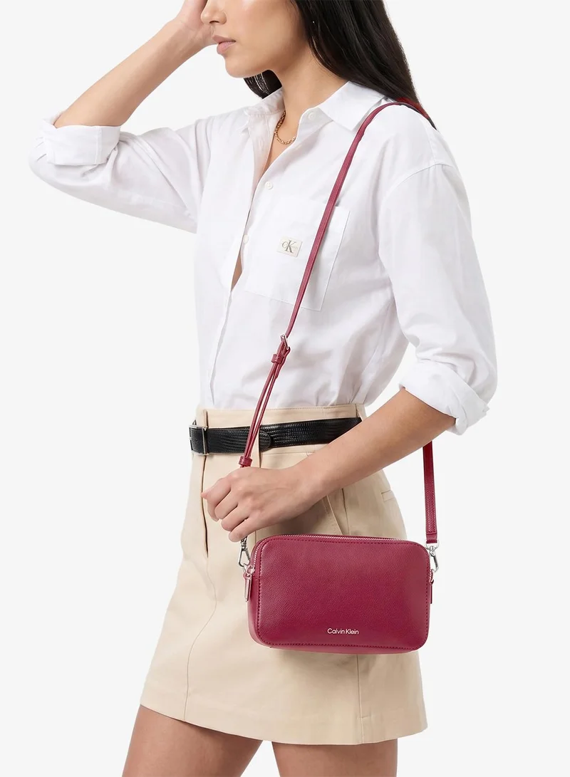 Calvin Klein Alluring Pink Foil Logo Camera Bag for Women | Best Price UAE