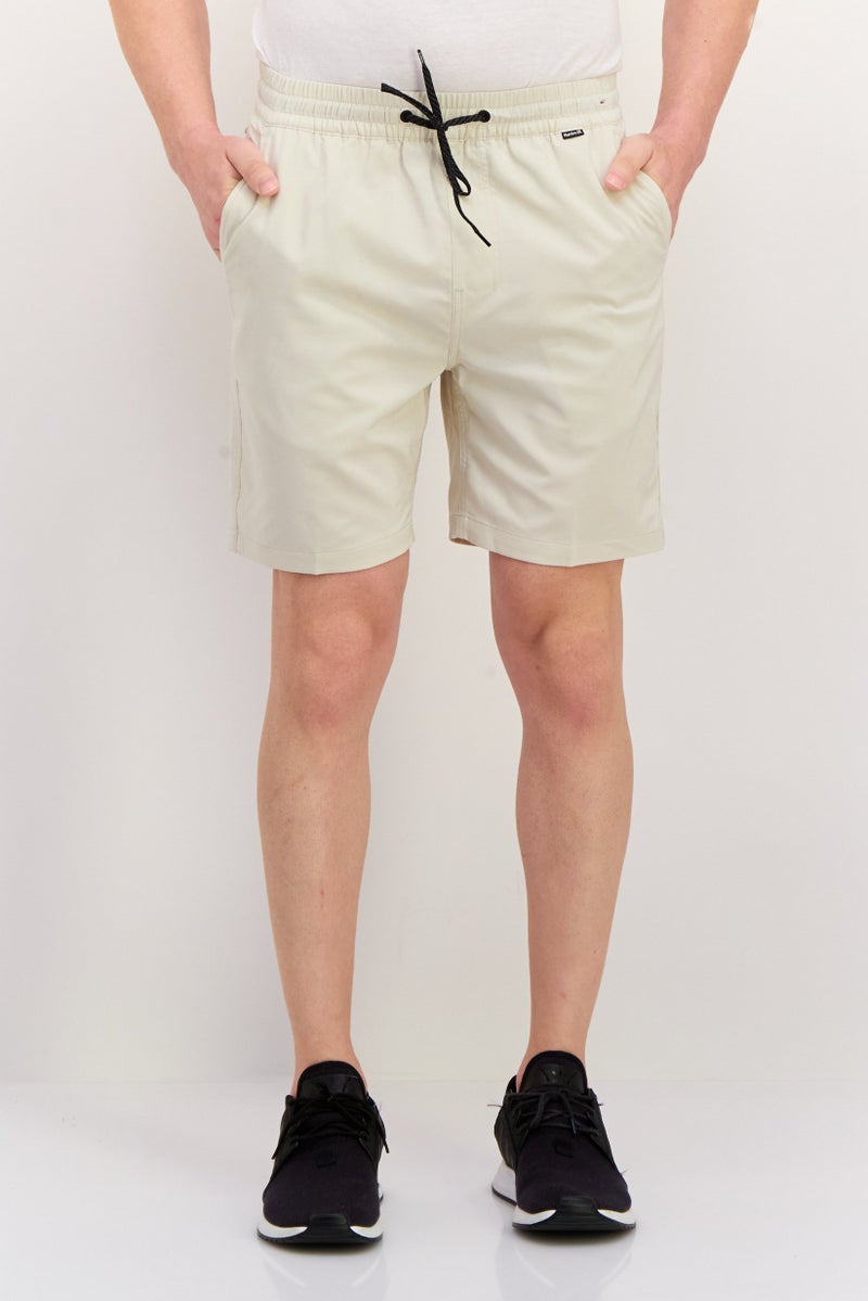 Hurley شورتات رياضية للرجال بطول 7 إنش، لون بيج فاتح - Image 1