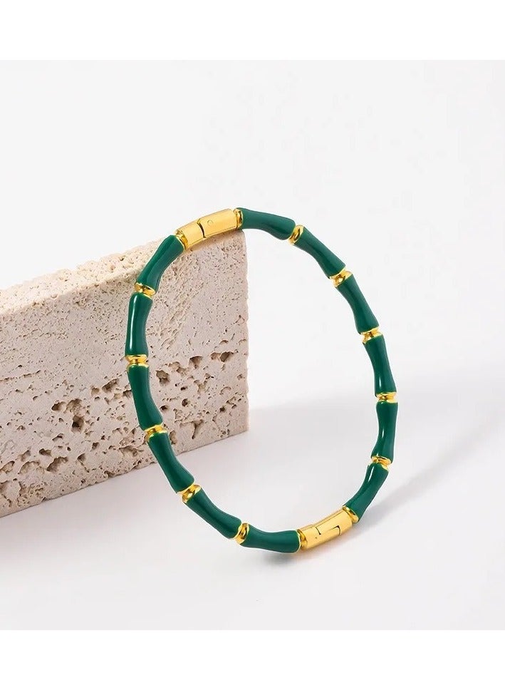 ذا بلاك بيرل اكسسوريز أسورة أستانليس ستيل ذهبي أخضر - Image 2