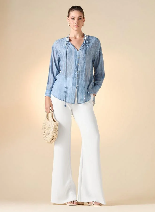 ايكونيك توب أيقوني بقصة عادية وتفاصيل شرابات صدفية