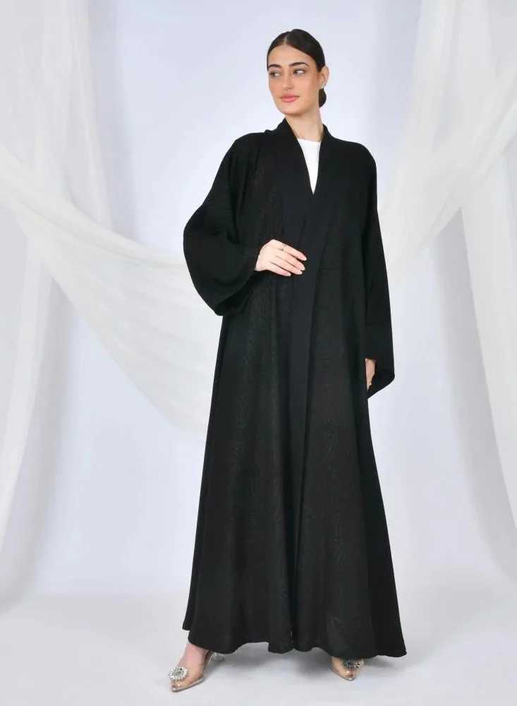 lamha abaya Elegant black quarter-cloche abaya with embroidered jacquard fabric and wide sleeves