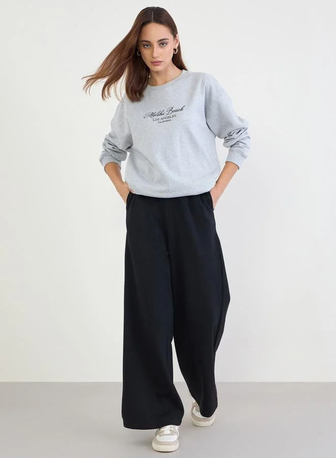 Styli Styli Printed Longline Sweatshirt and Wide Leg Joggers Co-Ords
