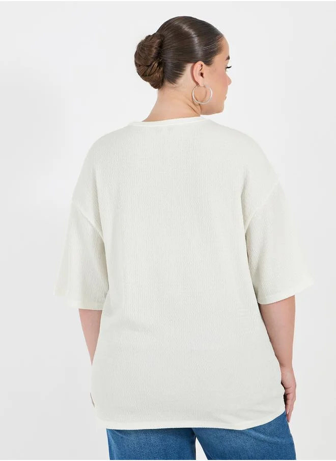 Styli Plus Size Textured Oversized T-Shirtâ€‹ with Patch Detail