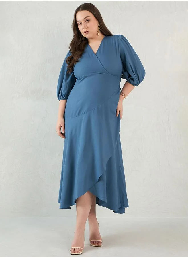 فيميلا Plus Size Solid Wrap Look A-Line Midi Dress by Styli