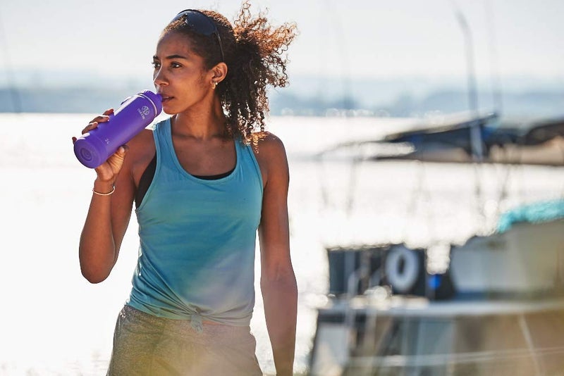 Takeya Actives Water Bottle with Spout Lid - Bottle with Double Stainless Steel Insulation - Dishwasher Safe & BPA-Free - Bottle with Spout Lid & Removable Bumper - 24 oz, Nitro Purple - Image 4