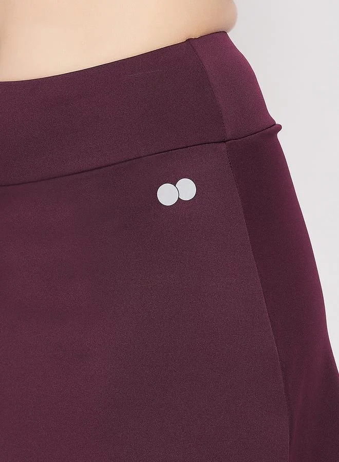 Clovia Maroon Maroon Snug Fit Active Skirt with Attached Tights for Women | Best Price UAE
