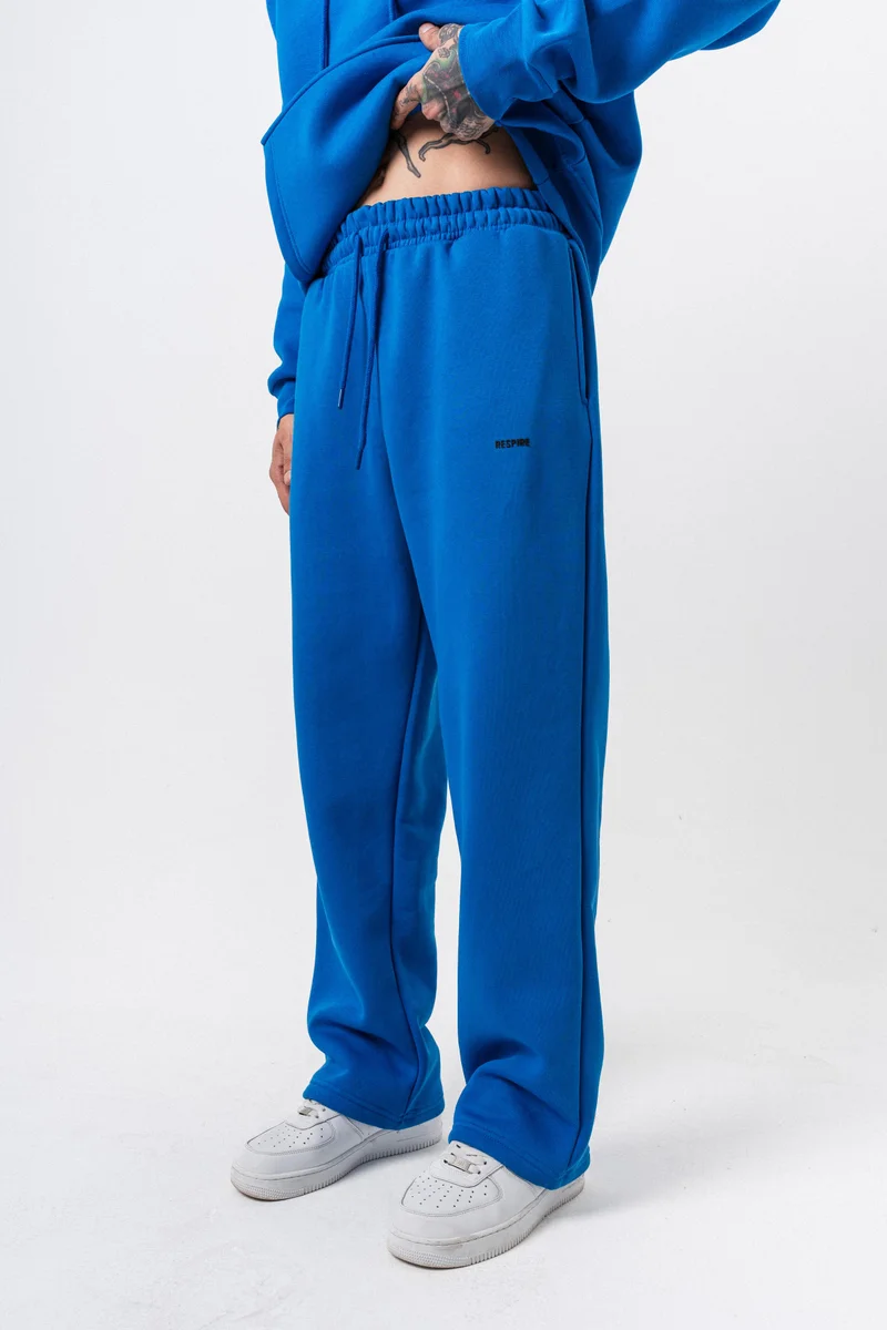 ريسباير بنطلون رياضي رجالي أزرق بقصة واسعة وتفاصيل حروف