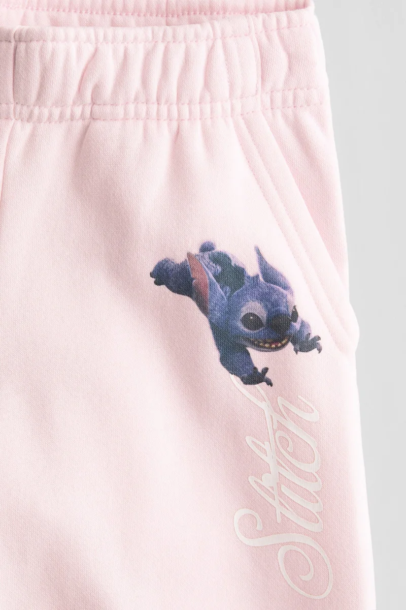 اتش اند ام بنطلون رياضي منسق مع سويت شيرت بطبعة زخرفية