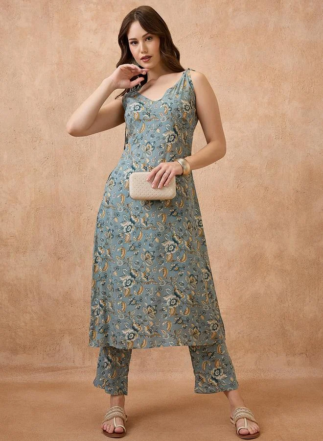 جلو باص طقم كورتا فيوجن بطبعة زهور وأكمام مربوطة مع بنطال مستقيم