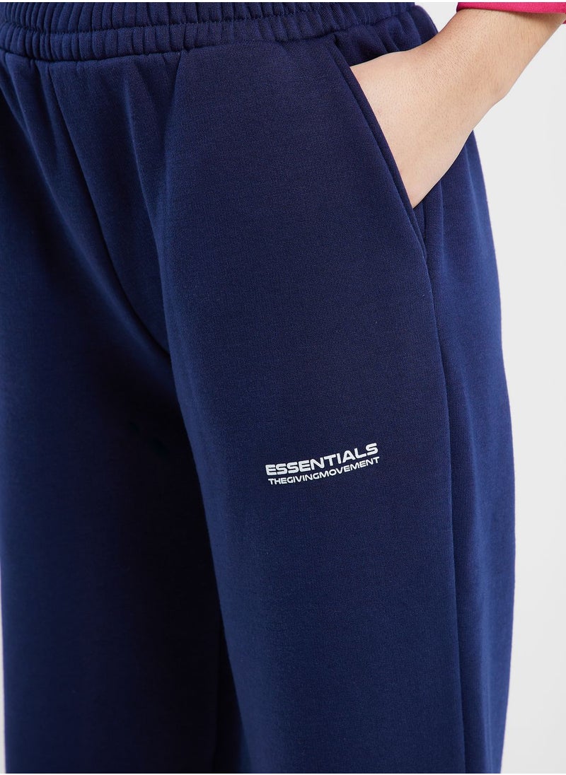 The Giving Movement - Wide Leg Logo Joggers - Image 1