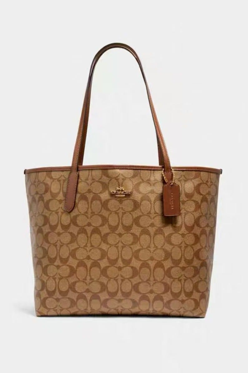 coachoutlet City Tote Bag In Signature Canvas - Image 1