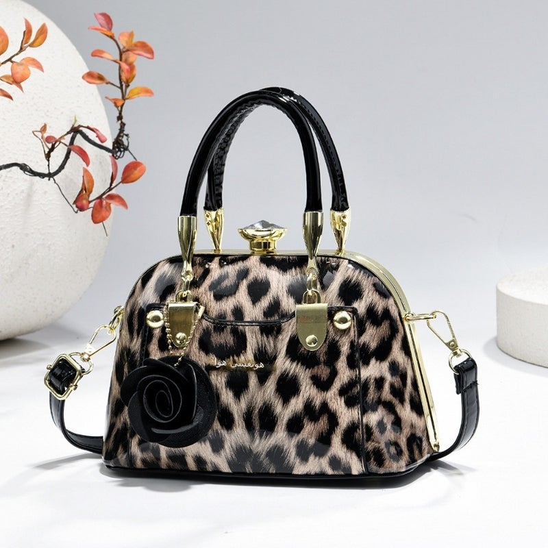 Steel armor mini shell bag, suitable for casual fashion, shiny surface, equipped with floral charm pendant, multi-functional handbag or cross-body bag, fashionable classic, lightweight and durable design