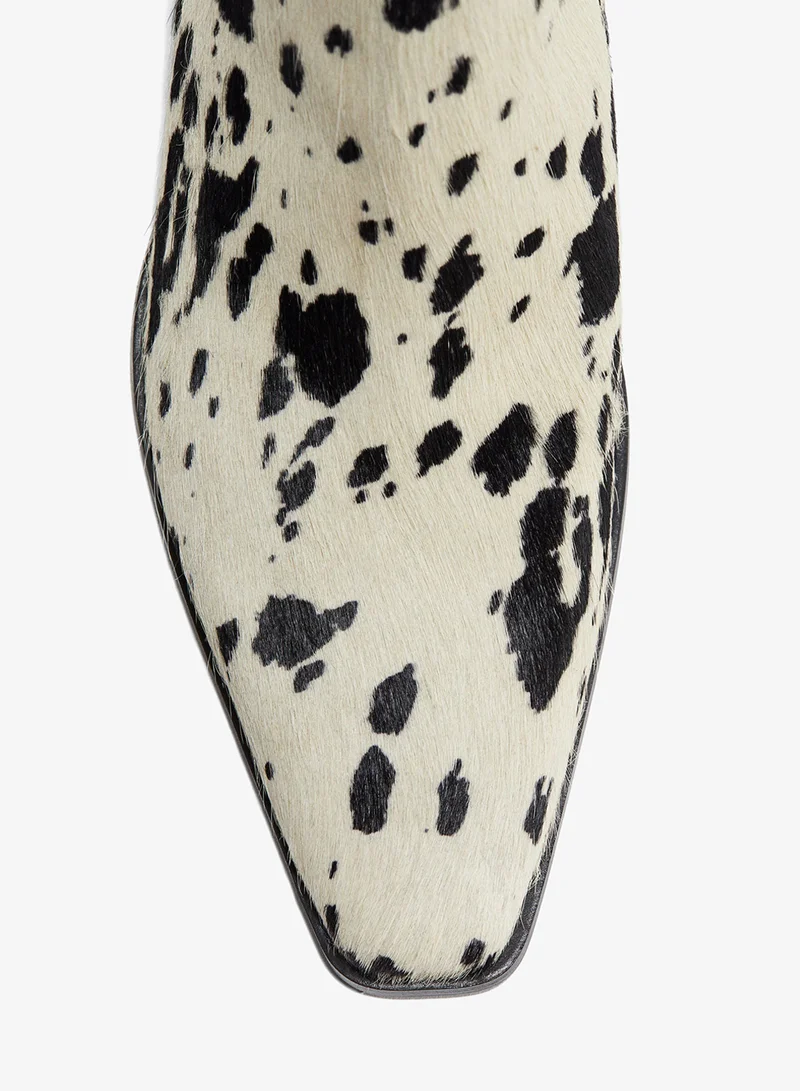 اتش اند ام بووت من الجلد