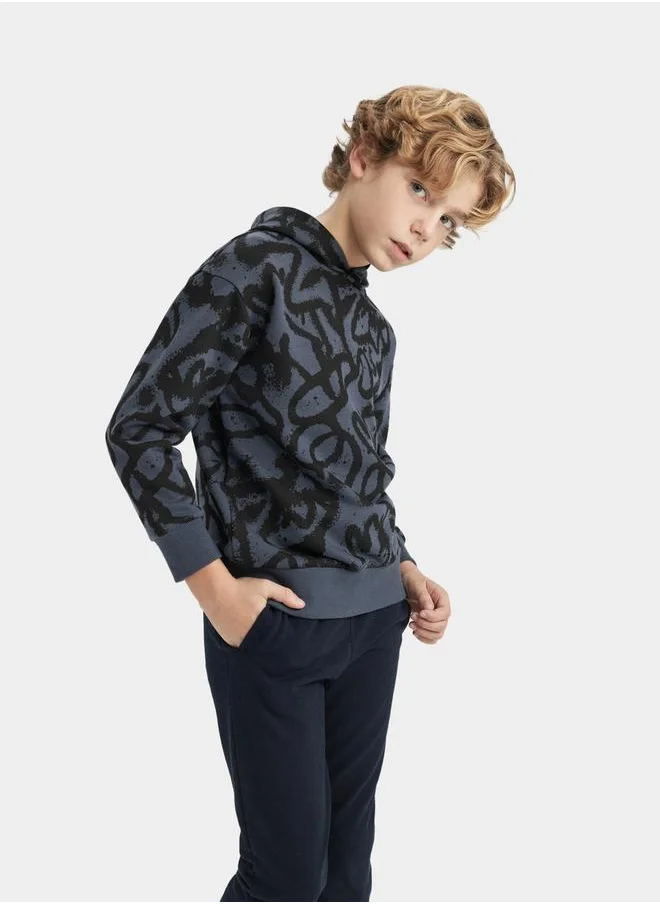 ديفاكتو All-Over Print Oversized Hooded Sweatshirt by Styli