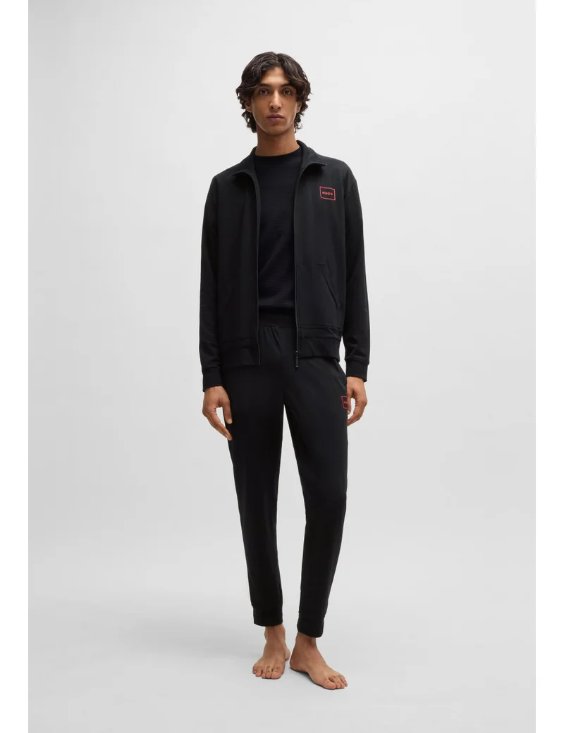 HUGO  Stretch-cotton tracksuit bottoms with logo print for Men | Best Price UAE