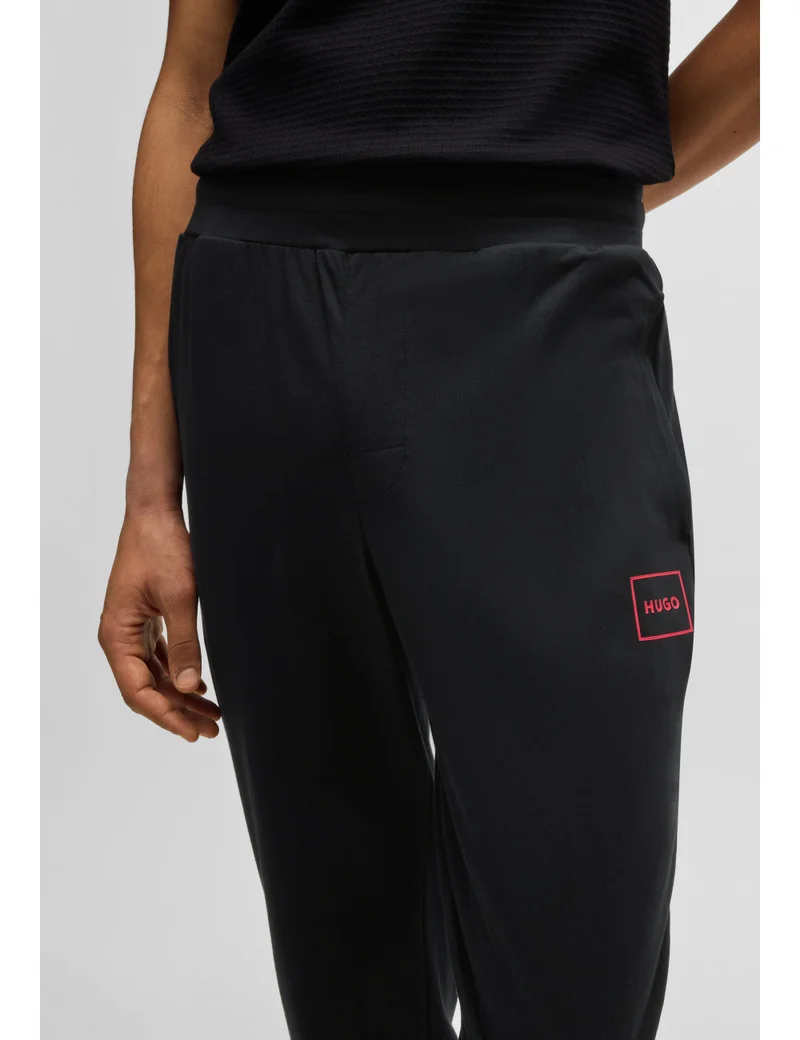 HUGO  Stretch-cotton tracksuit bottoms with logo print for Men | Best Price UAE