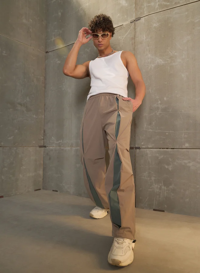 SASSAFRAS Front Invert Pleat Baggy Parachute Pants