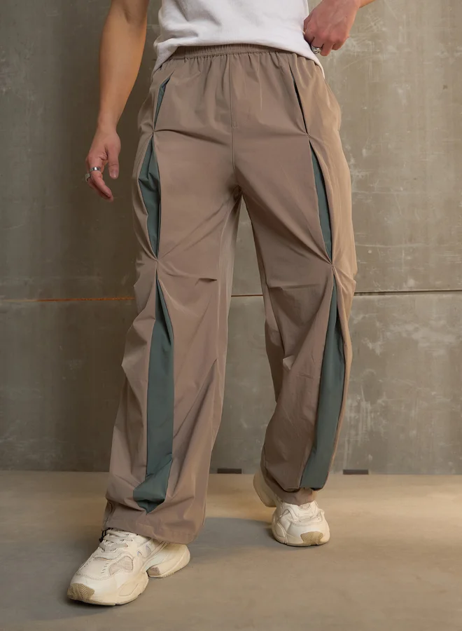 SASSAFRAS Front Invert Pleat Baggy Parachute Pants