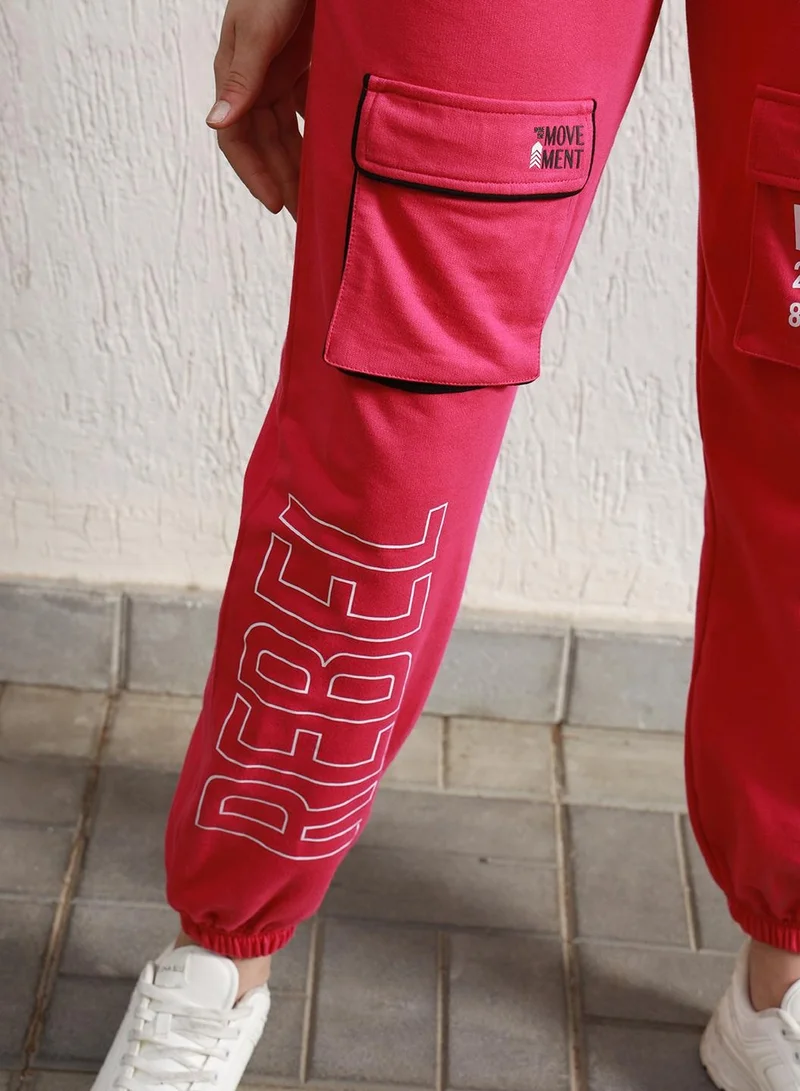 Hubberholme Women's Pink High-Rise Relaxed Fit Cargo Joggers with Typography Print