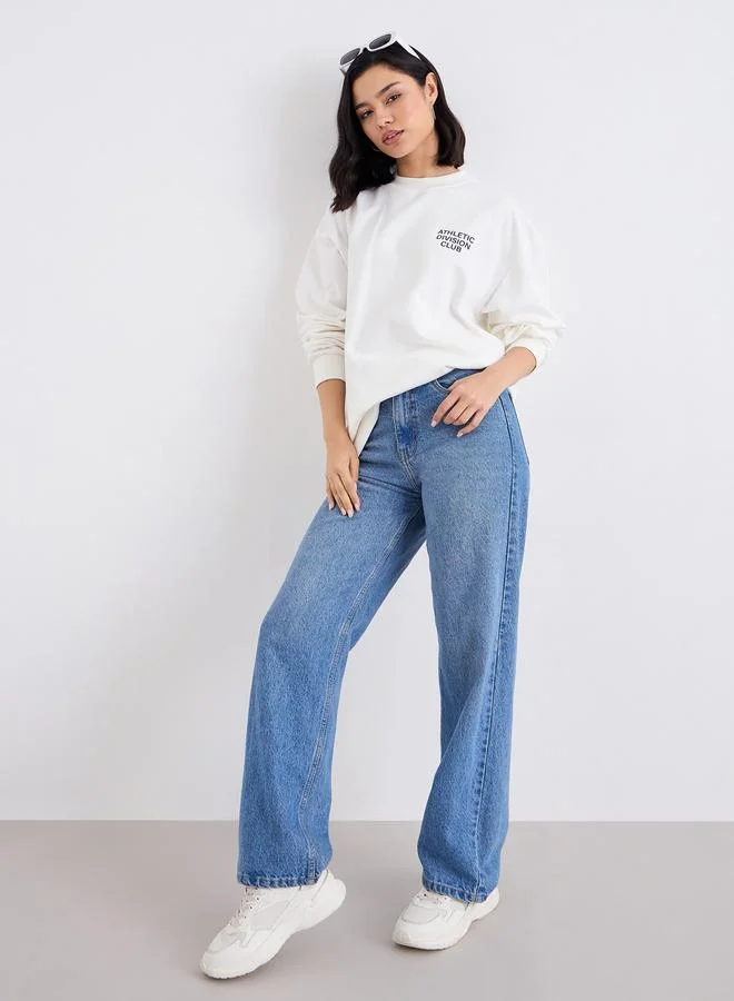 Styli Women Off White Regular Fit Longline Sweatshirt with Slogan Print