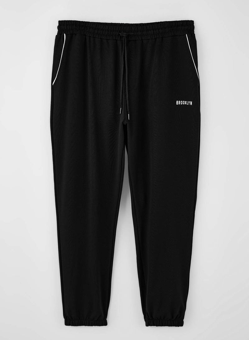 trendyol Black Large Size Regular Fit Printed Piped Rubber Leg Sweatpants Tmnss26Aj00001 - Image 2
