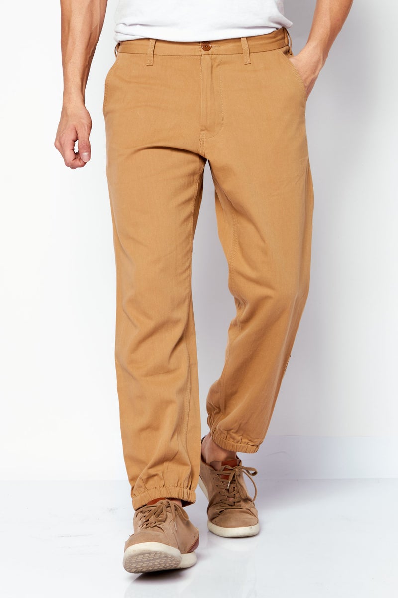 GUCCI Men Regular Fit Solid Drawstring Pants, Tan - Image 1