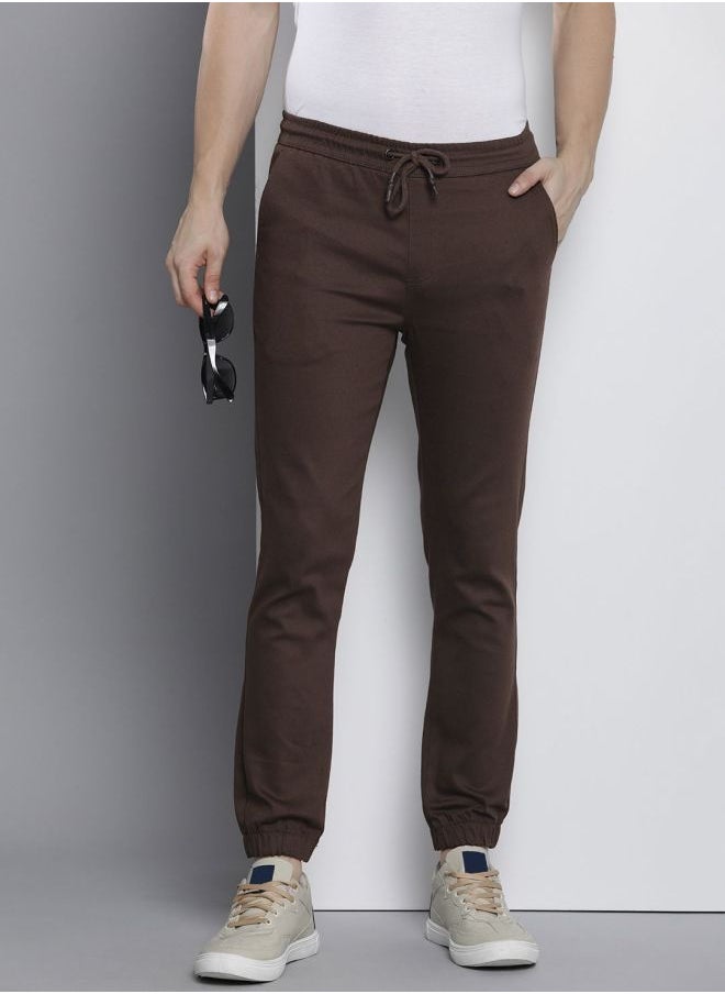 The Indian Garage Co Men Slim Fit Solid Mid-Rise Stretchable Chino Joggers  - Image 1