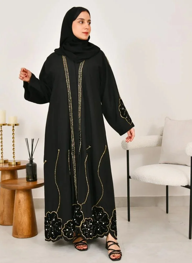 lamha abaya Black wrap abaya with prominent embroidery and black velvet overlay on flowers