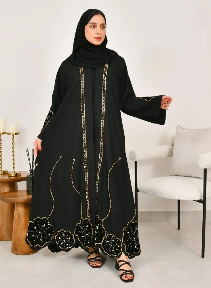 lamha abaya Black wrap abaya with prominent embroidery and black velvet overlay on flowers