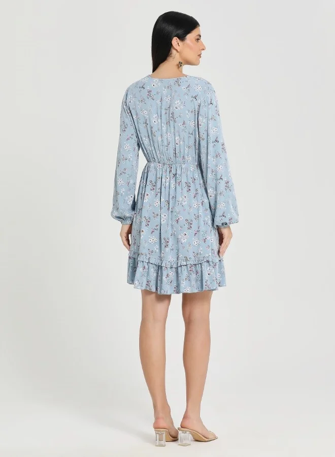 ZABAIONE Elegant Blue Floral Long Sleeve Mini Dress with Ruffled Hem