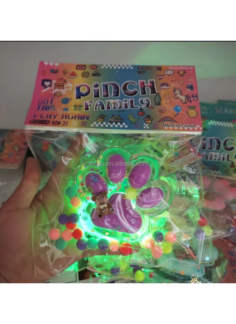 null - Light-up cat paw squishy, ​​featuring a cute, fun design and attractive colors. It has an internal light that lights up when squeezed, adding a fun and exciting element. - Image 1