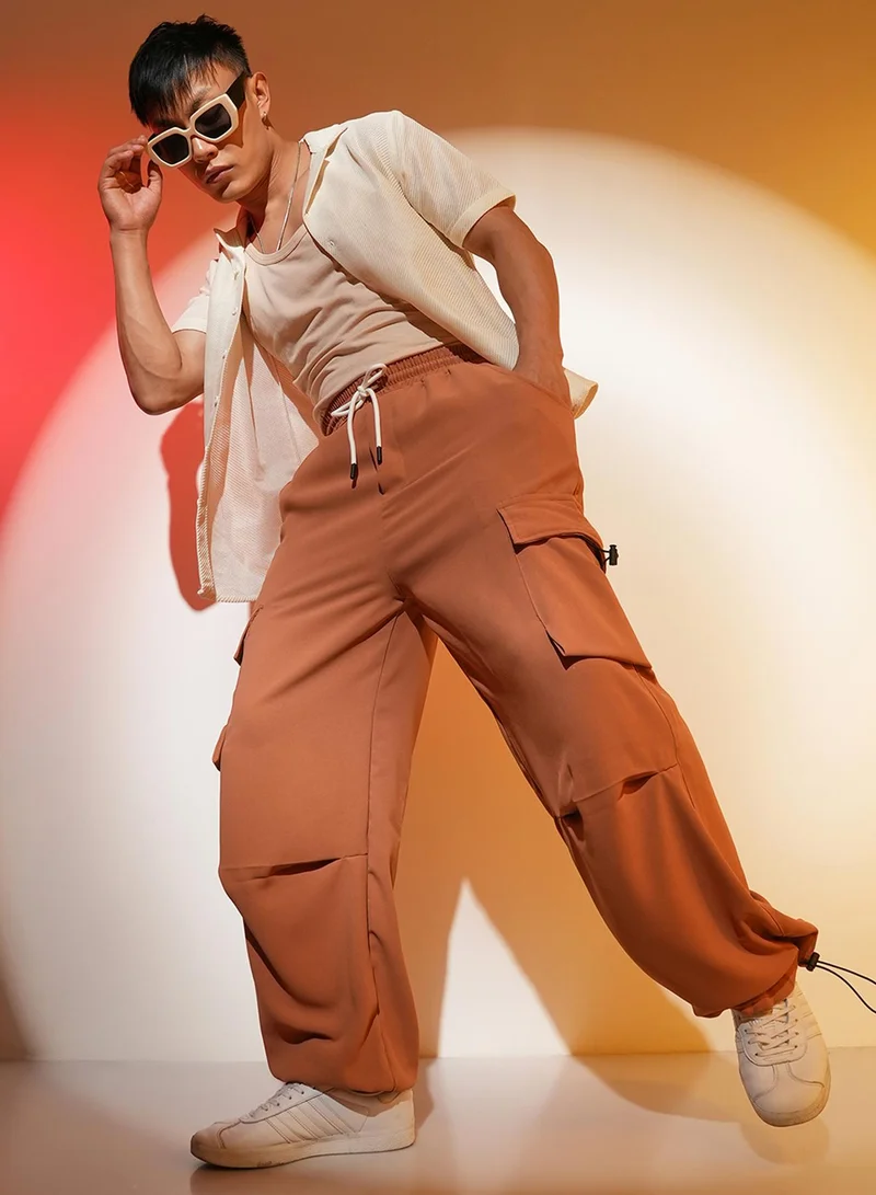 Campus Sutra Men's Sienna Brown Solid Cargo Parachute Trousers