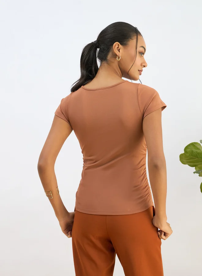 SASSAFRAS Sassafras Orange Knitted Short Sleeve Ruched Crop Top