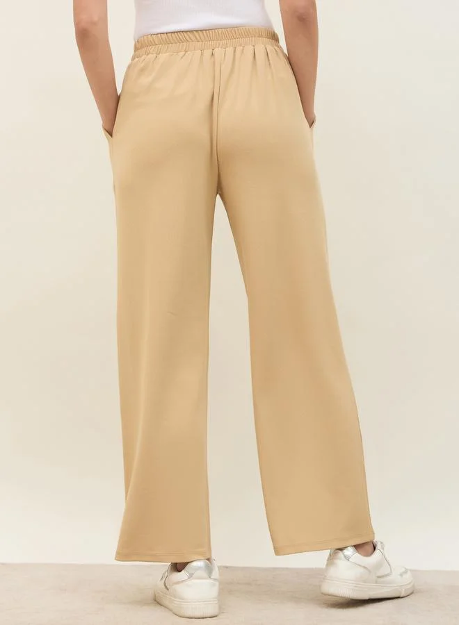 Styli Mid Rise Wide Leg Pants with Elasticated Waistband