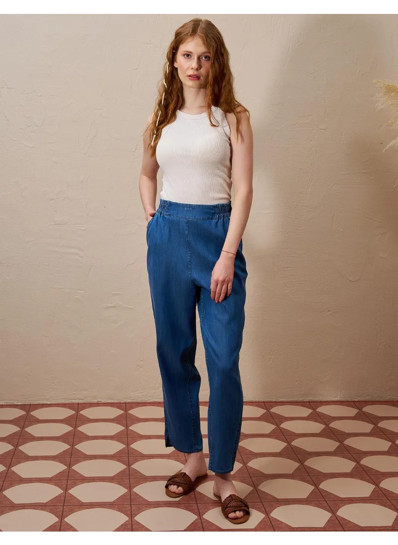 Kayra High-Waisted Elasticated Tapered Lyocell Pants Indigo