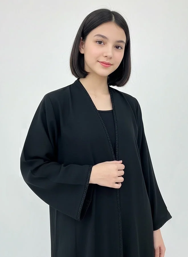 HAWRAA ABAYA Black girls’ abaya adorned with elegant black trim