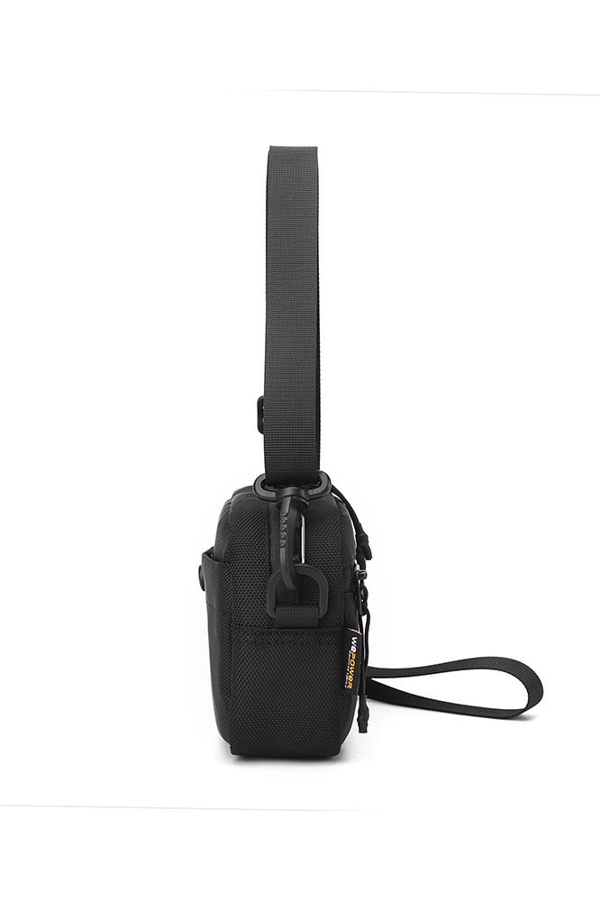 Tactical Sling Bag for Men & Women, Rugged 1680D Ballistic Nylon Crossbody Bag, Water-Repellent & Durable EDC Pack. This compact rectangle-shaped sling bag features an intelligently organized interior with a large main pocket, internal compartments, key hook, and specialized pockets for secure storage. The highly adjustable and detachable strap allows multiple carry modes: as a crossbody bag, over the shoulder, around the waist, or as a sleek clutch using the top handle/wrist strap. Ideal for urban navigation, work commute, weekend hiking, travel, and tactical operations. Built to last with a focus on functionality, security, and a modern tactical style. This versatile companion keeps your essentials like phone, wallet, tools, and valuables organized and within easy reach. Redefine your everyday carry with this smart, adaptable, and sturdy unisex bag. Perfect for outdoor enthusiasts, professionals, students, and anyone seeking a reliable and stylish hands-free solution. Key features in