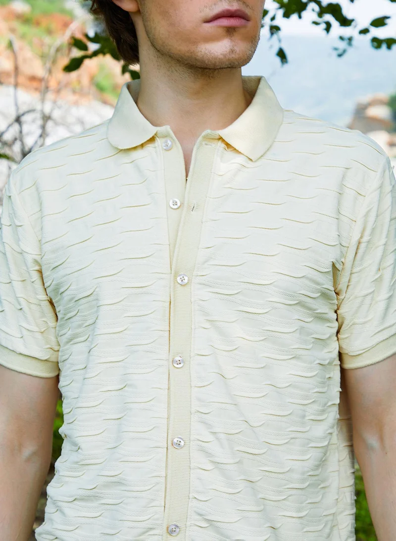 Campus Sutra Campus Sutra Men's Off-White Solid Creased Knit Shirt For Casual Wear | Polo Neck | Short Sleeve | Button Closure | T-Shirt Crafted With Comfort Fit For Everyday Wear