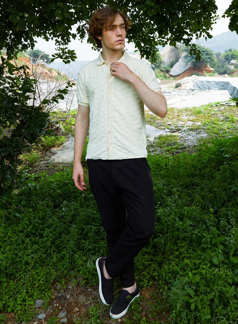 Campus Sutra Campus Sutra Men's Off-White Solid Creased Knit Shirt For Casual Wear | Polo Neck | Short Sleeve | Button Closure | T-Shirt Crafted With Comfort Fit For Everyday Wear