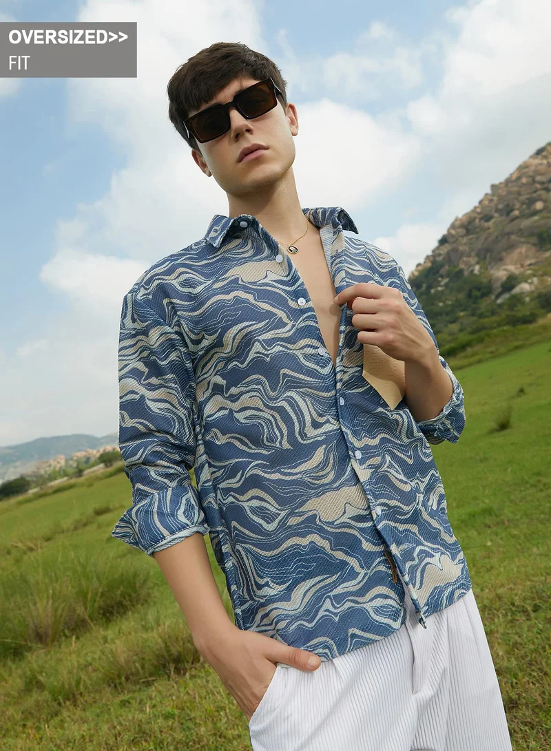 Campus Sutra Campus Sutra Men's Indigo Blue Fluid-Block Shirt For Casual Wear | Spread Collar | Long Cuffed Sleeves | Button Closure | Oversized Shirt Crafted With Comfort Fit For Everyday Wear