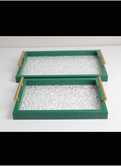 Serving tray set with gold handles.