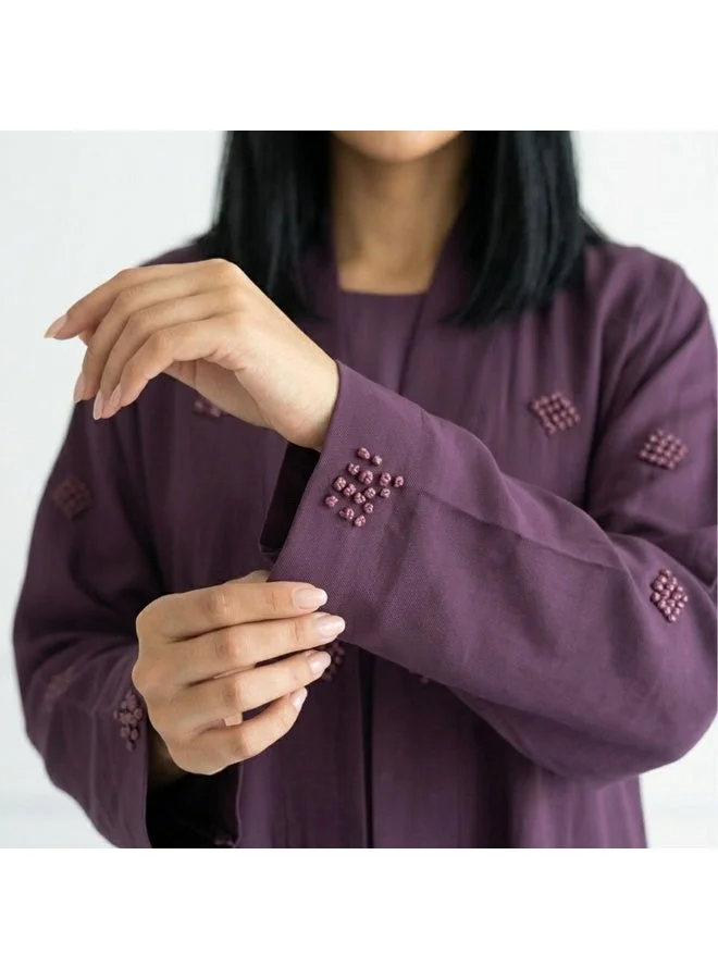 Hawraa Abaya Purple wrap abaya featuring prominent embroidery across the entire abaya