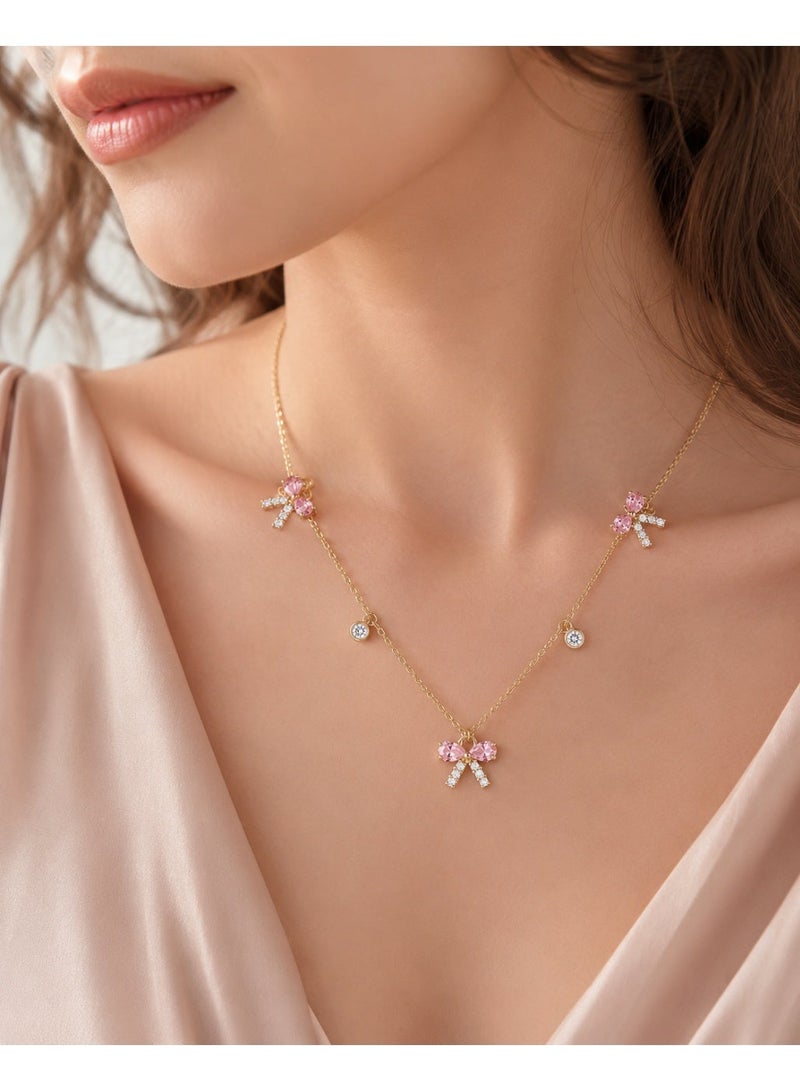 RAFAL Women's Gold-Tone Station Necklace with Three Pink Crystal Bow Charms - Image 3