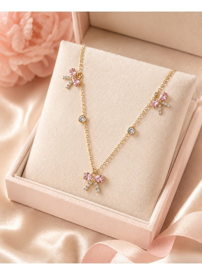 RAFAL Women's Gold-Tone Station Necklace with Three Pink Crystal Bow Charms - Image 4