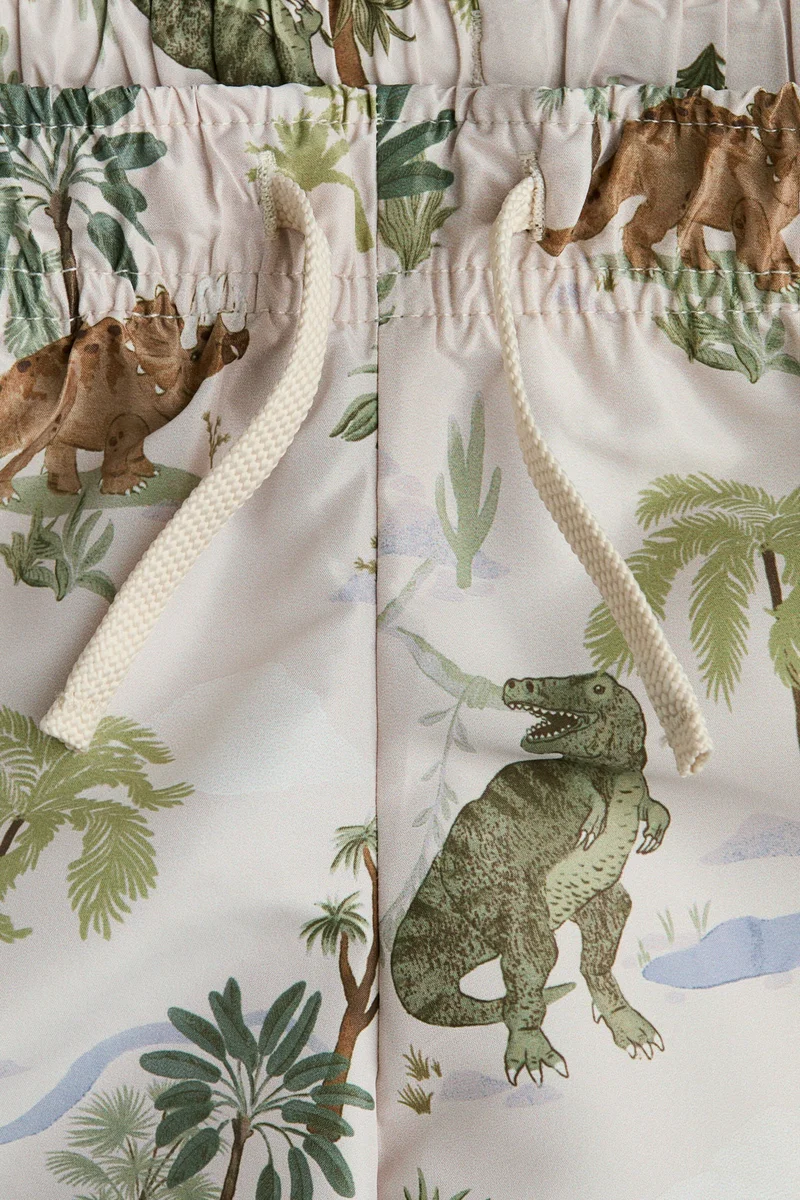 اتش اند ام شورت سباحة مزين بطبعة