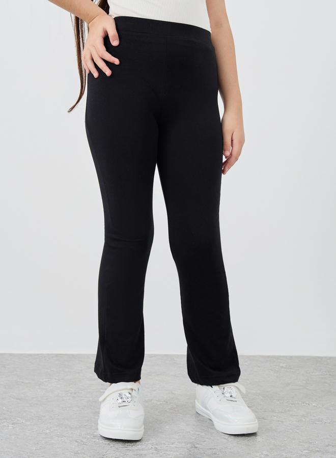 Styli Styli Girls Black Solid Elasticated Waistband Flared Leggings  - Image 1